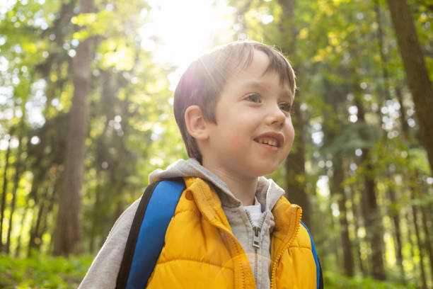 istock 6 year old boy on a walk in the park 1694231788