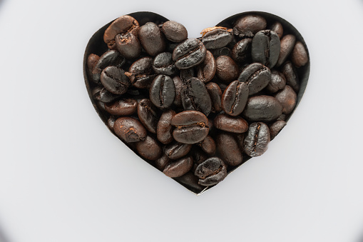 Heart shaped coffee beans - white background