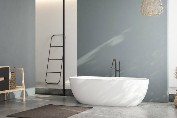 istock Modern minimalist bathroom interior, modern bathroom cabinet, white sink, wooden vanity, interior plants, bathroom accessories, bathtub and shower, white and blue walls, concrete floor. 1694250970