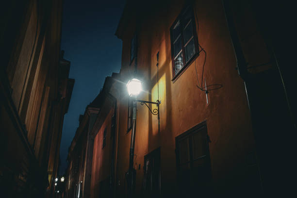 istock Low angle view of buildings against sky at night 1694258802