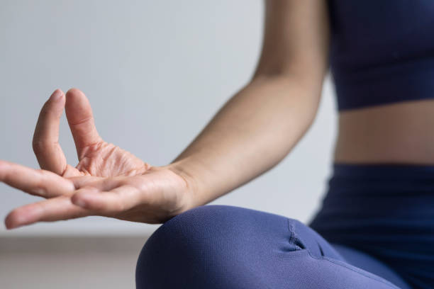 istock Woman doing mudras with her fingers 1694272942