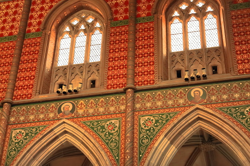 Melbourne, Australia-October 22, 2018: The Geometric Decorated Gothic revival style St.Patrick's Cathedral interior displays a central nave, a lateral aisle on each side, alabaster-panel windows.