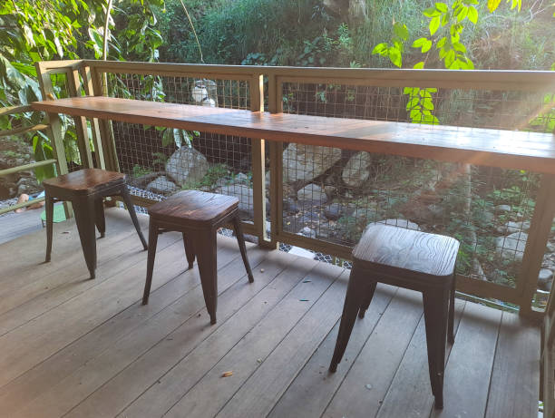 istock wooden chairs and coffee table outdoors 1694344121
