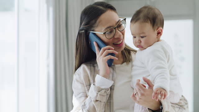Mother, baby and phone call with talking, home and smile for care, love and bonding with connection. Mom, infant child and smartphone for happy conversation, listening and contact in family house