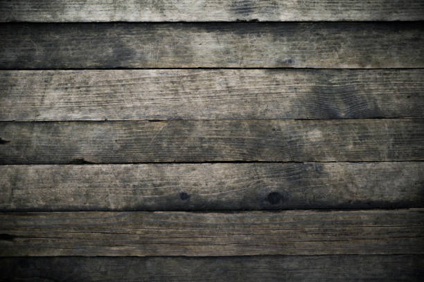 istock Old wooden dark plank texture background 1694349660