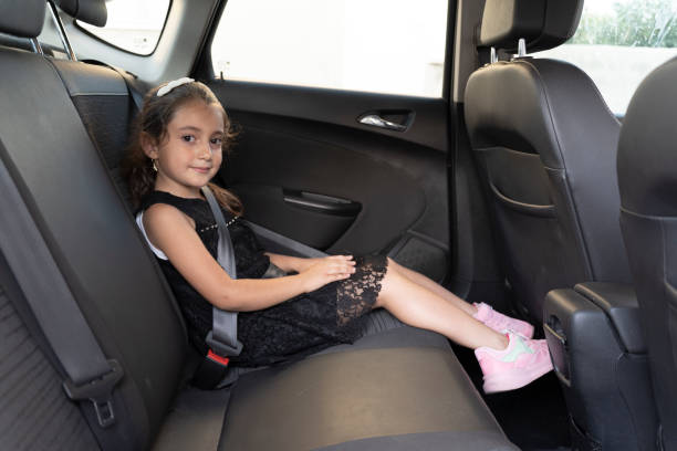 istock Girl using a tablet in the car. 1694356820