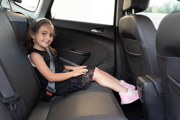 istock Girl using a tablet in the car. 1694356833