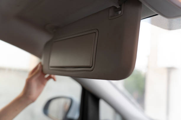istock Man Holding Sun Visor In Car 1694358433