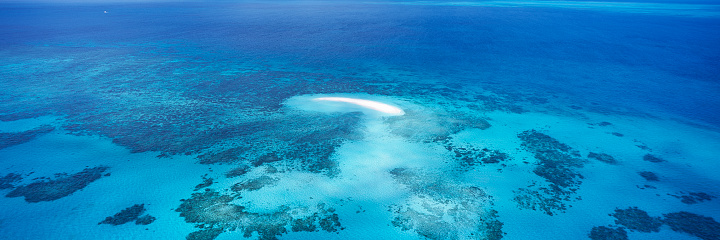 Wide angle panoramic aerial view of Vlasoff Cay on the Great Barrier Reef, Queensland.
