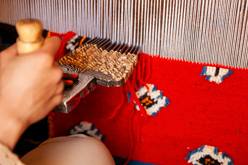 A rug being woven on a loom in Turkey.