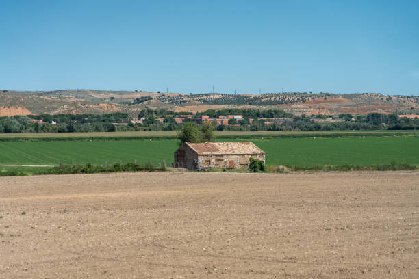istock Old house to store agricultural tools in a Spanish crop field 1694407467