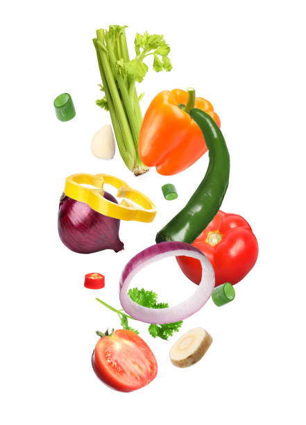istock Spice mix for dish. Set of falling fresh vegetables and herbs on white background 1694445571