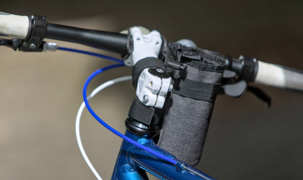 bike handlebar bag on bars with stem, grips, bell (water bottle holder for bicycle cockpit)