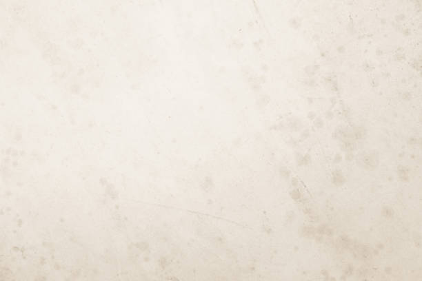 istock Colour old concrete wall texture background. Close Up retro plain cream color cement wall background texture. Design paper vintage parchment element show or advertise or promote product on display. 1694497592