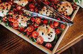 Burrata cheese with cherry tomatoes and fresh greens