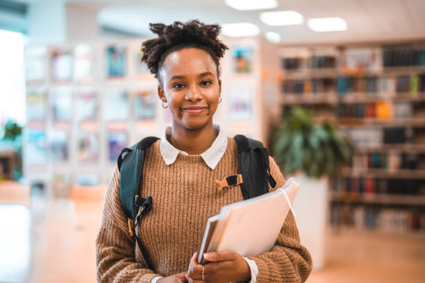istock Hispanic Young Adult Female In A Library 1694509371
