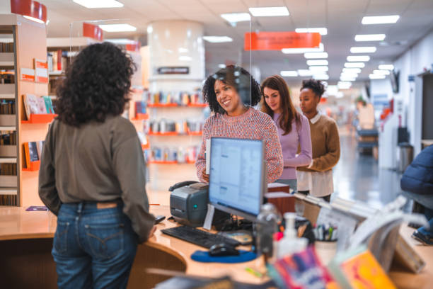 istock Diverse People Waiting In Line In A Library 1694509378