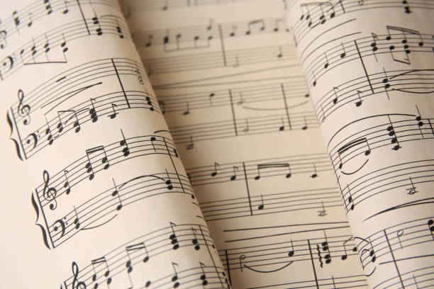 Closeup view of sheets with music notes Closeup view of sheets with music notes sheet music stock pictures, royalty-free photos & images