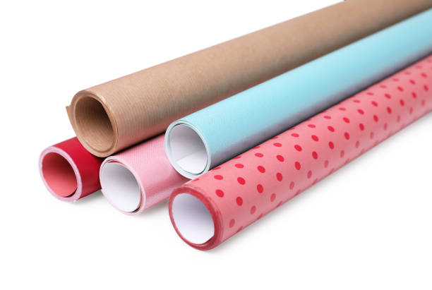 istock Rolls of colorful wrapping papers on white background 1694520073