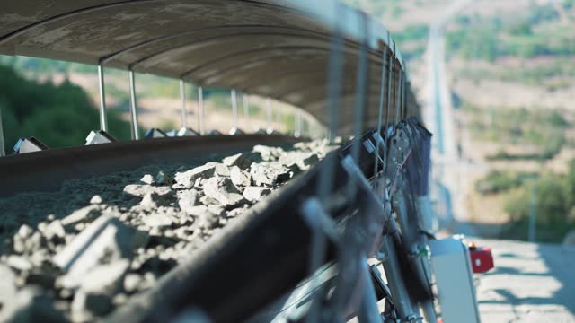 Ore transportation conveyor for subsequent processing from open pit mine, slow motion