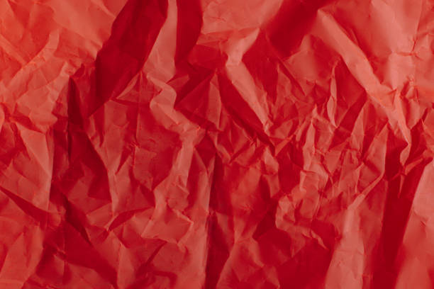 istock Bright red paper background. Concept for holiday. 1694563372
