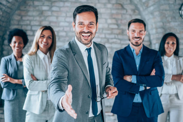 istock Confident businessman and his team. 1694566123