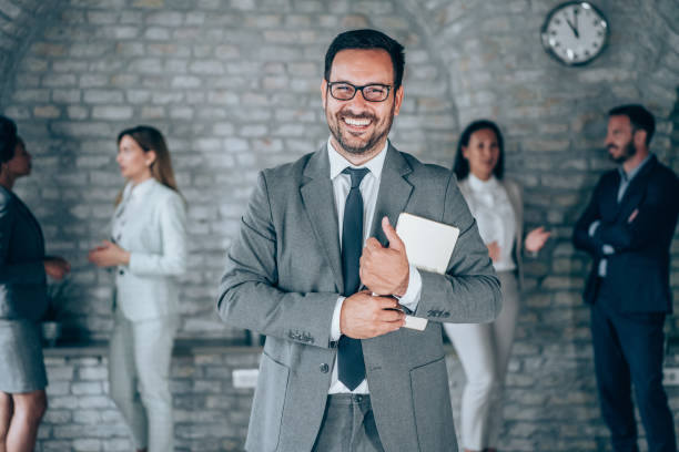 istock Confident businessman and his team. 1694566507