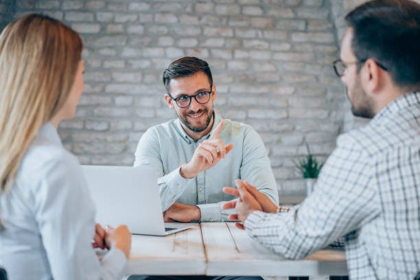 istock Group of business persons talking in the office. 1694566642