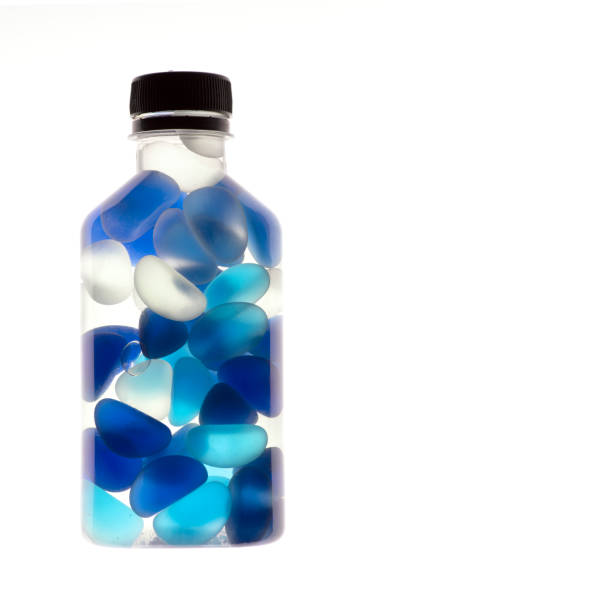 Plastic bottle containers coloured glass stones mixing to creating unique textures and patterns Thailand Asia