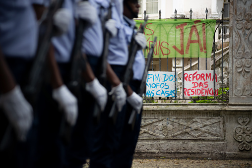 São Paulo, Brazil, January, 09, 2015: Woman searching for information is attacked by riot police in act for the reduction of transport tariffs in Consolação Avenue