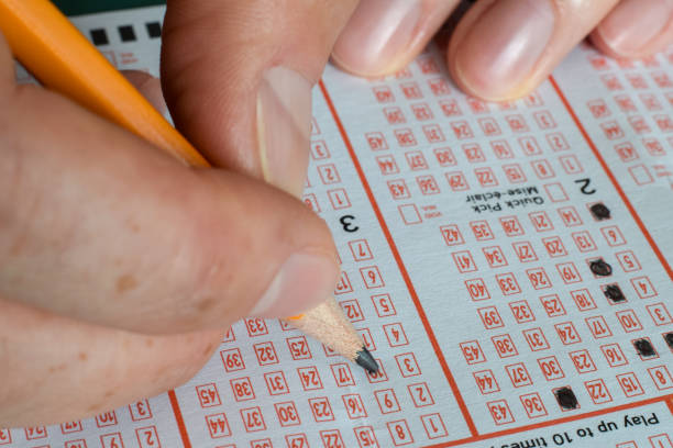 Lottery ticket on the floor.  Symbolic image of losing at gambling and wasting money.