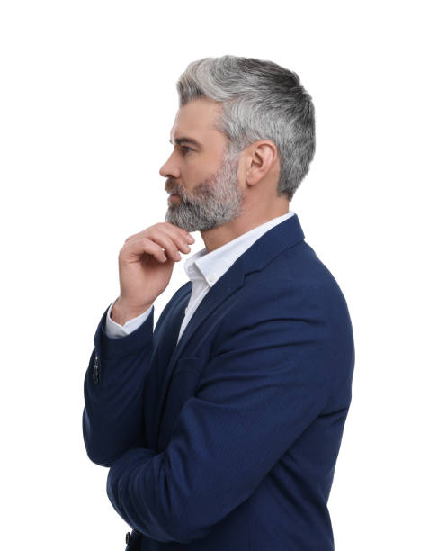 istock Mature businessman in stylish clothes posing on white background 1694590137