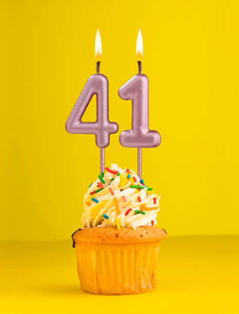 istock Number 41 candle - Birthday card design in yellow background 1694592013
