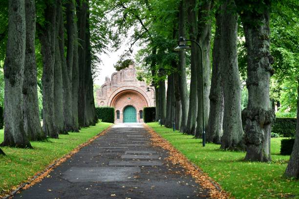 A beautiful wooded pathway through a small park to a church in Roskilde, Denmark