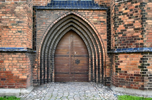 A shot of a heavy wood and metal church door on a church in Malmo Sweden