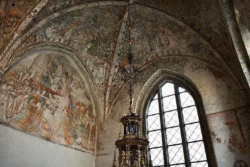 Medieval artwork on a very old church ceiling in the city of Malmo, Sweden.