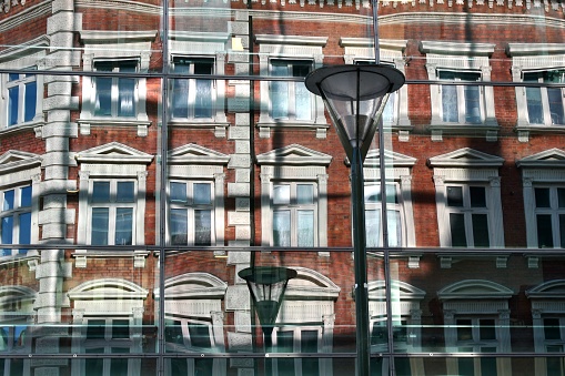 Apartment windows from brick facade of a building in New York City.