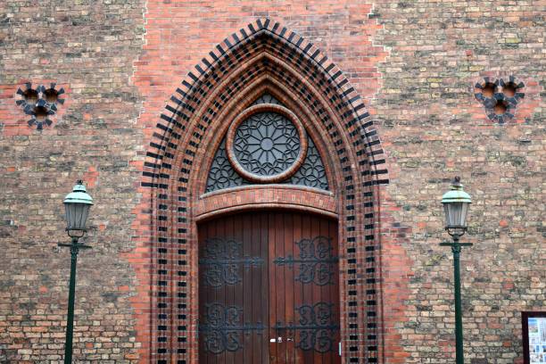 A shot of a heavy wood and metal church door on a church in Malmo Sweden