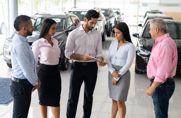istock Sales team in training at a car dealership 1694629226