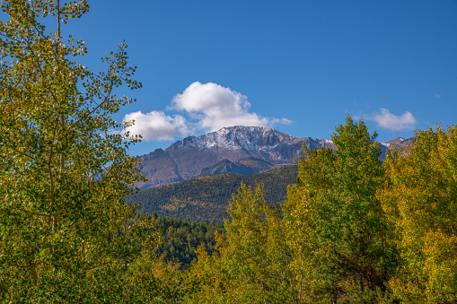 The snow kissed summit of Pikes Peak, America's Mountain (elevation 14115 feet) in the Rocky Mountains in central Colorado in western USA of North America. Nearby cities are Colorado Springs, Denver and Pueblo, Colorado.