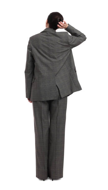 istock Businesswoman in suit on white background, back view 1694633721
