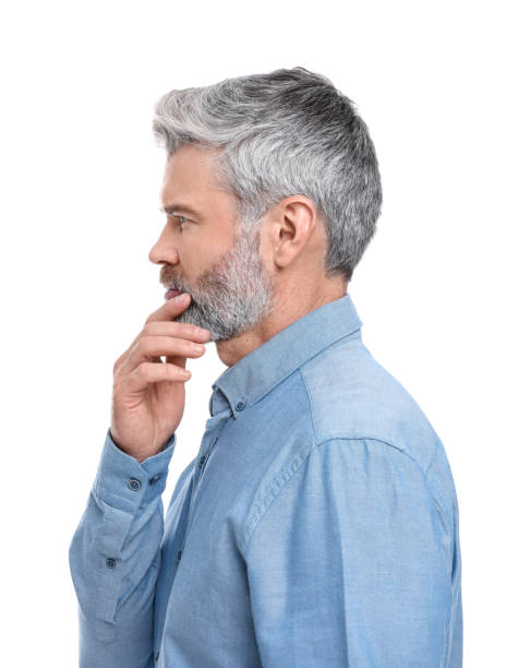istock Mature businessman in stylish clothes posing on white background 1694638428