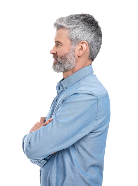 istock Mature businessman in stylish clothes posing on white background 1694638430