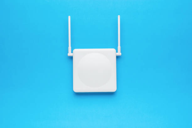Wi-Fi router with two antennas on the blue screen. The concept of wireless data transmission. Flat lay.