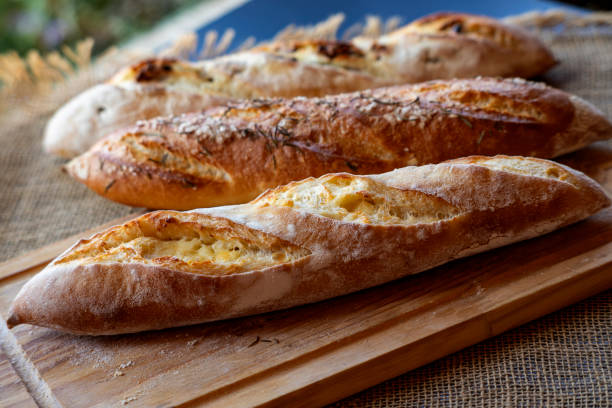 istock baguette  bread stuffed with canastra cheese on a board and tablecloth 1694649763