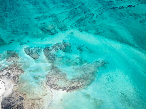 istock Abstract aerial view of sand and water patterns 1694714983
