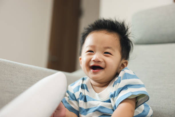 istock A baby boy playing a hair dryer 1694718253