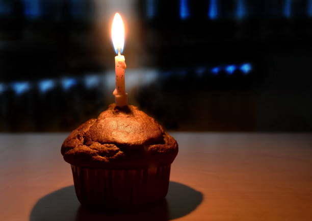 istock Cupcake with birthday candle 1694806173