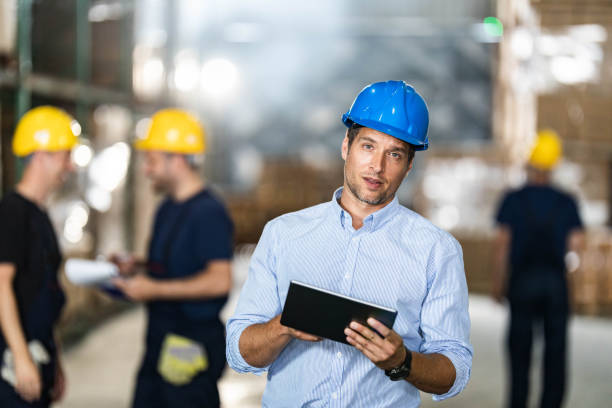 istock Mid adult foreman with digital tablet in a warehouse. 1694813932
