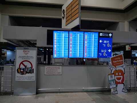 Bangkok, Thailand-May 26, 2023: Flight information board at Don Mueang International Airport, Bangkok